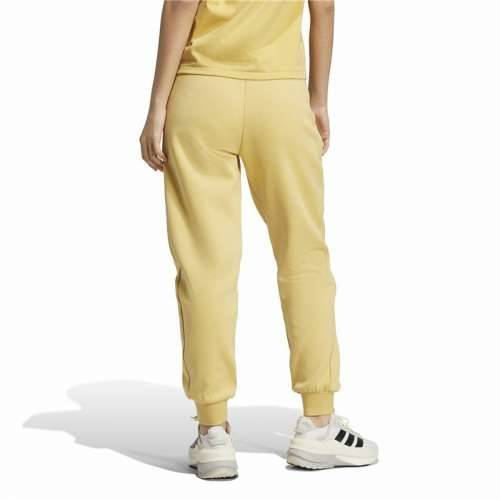 Dlhé športové nohavice Adidas Z.N.E. Rumena Dama Cijena